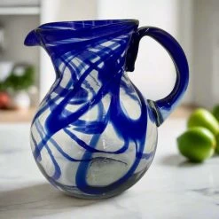 Blue Swirl Glass Pitcher | Hand-Blown Mexican Drinkware 8 Blue Swirl Glass Pitcher | Hand-Blown Mexican Drinkware -Pottery And Glassware il fullxfull.4986749939 lnzo aa2eb6b0 40cc 4555 ae9b 9dedb0fc8a35
